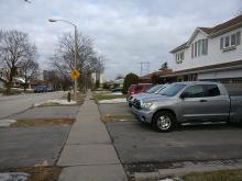 Dolly Varden: quiet residential street with detached single family homes. No transit routes and relatively low levels of traffic.